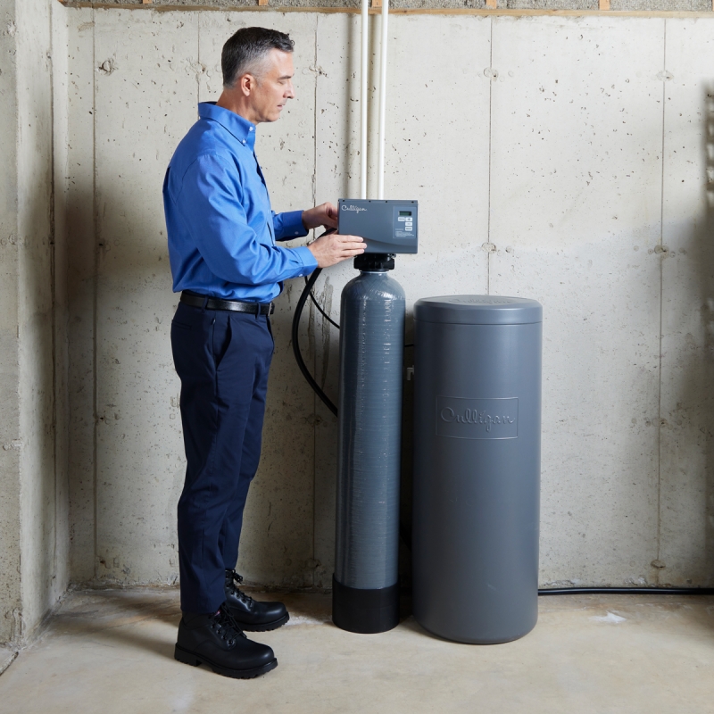Culligan employee installing water softener