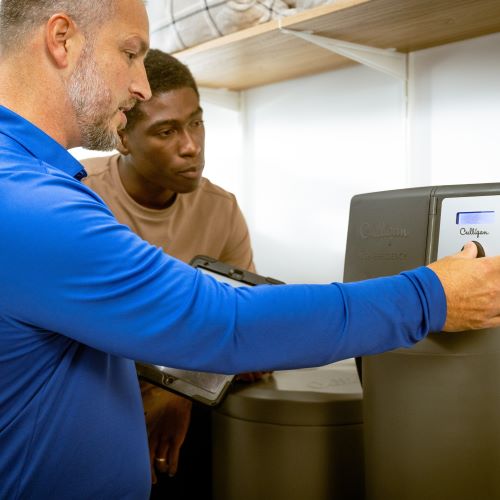 Culligan expert discussing water softener installation costs and process