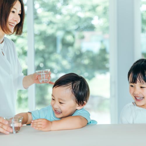 Mother providing cleaner, safer drinking water to her kids
