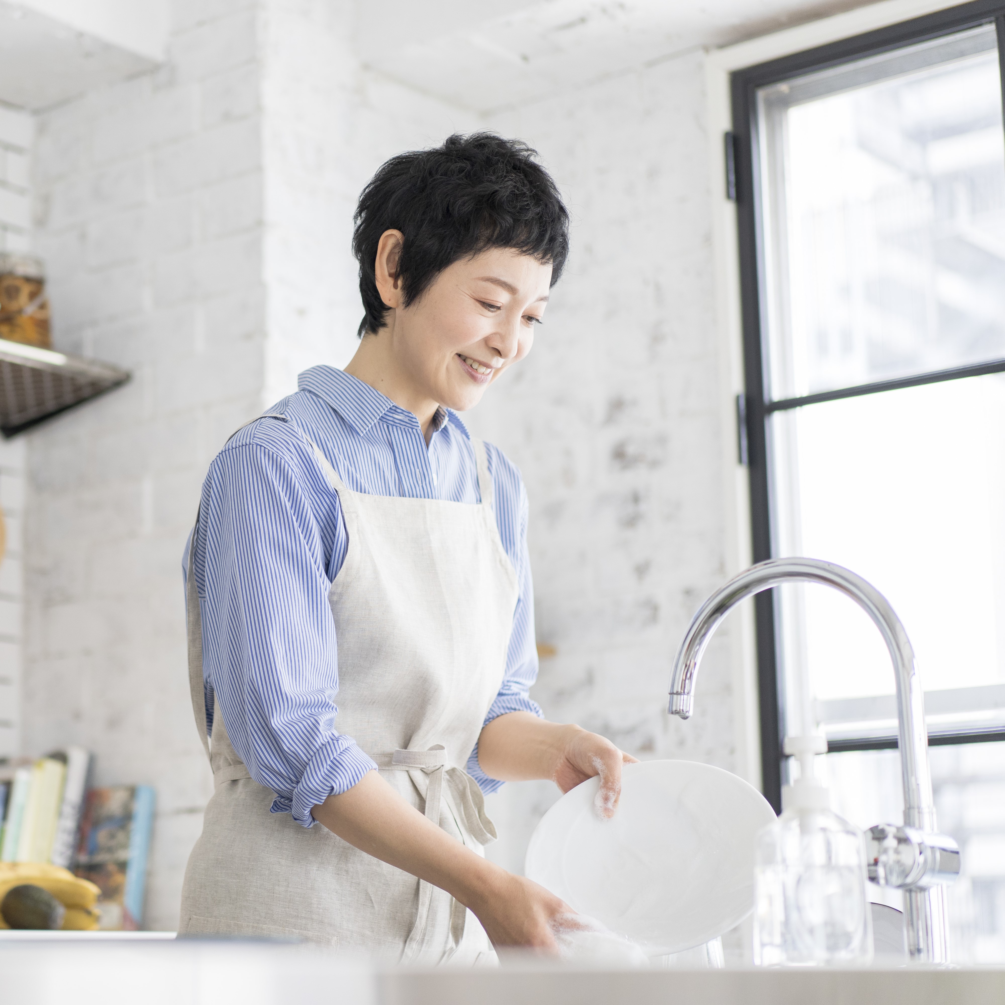 Woman washing dishes
