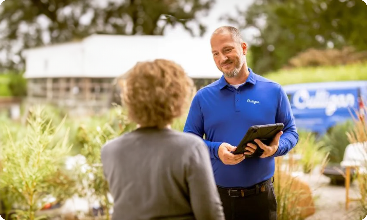 Culligan Water Testing Professional Speaking With Customer